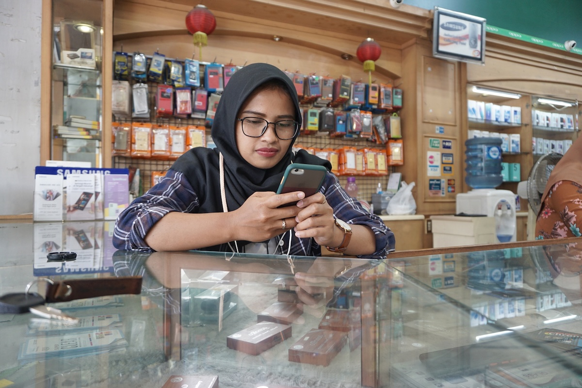 Woman in Indonesia using a digital wallet